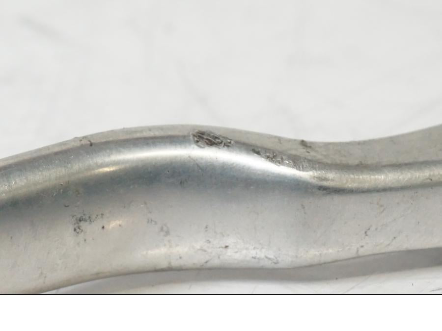 Snett nerifrån på <p>Bromsgrepp från Husqvarna TE 310 2009.</p>

<p>Mindre skrapmärken på knoppen samt ytliga repor se bilder.</p> motorcykel.