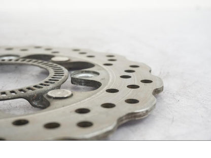 Vänster sida på Bromsskiva från en Kawasaki ER-6N -2014 motorcykel.