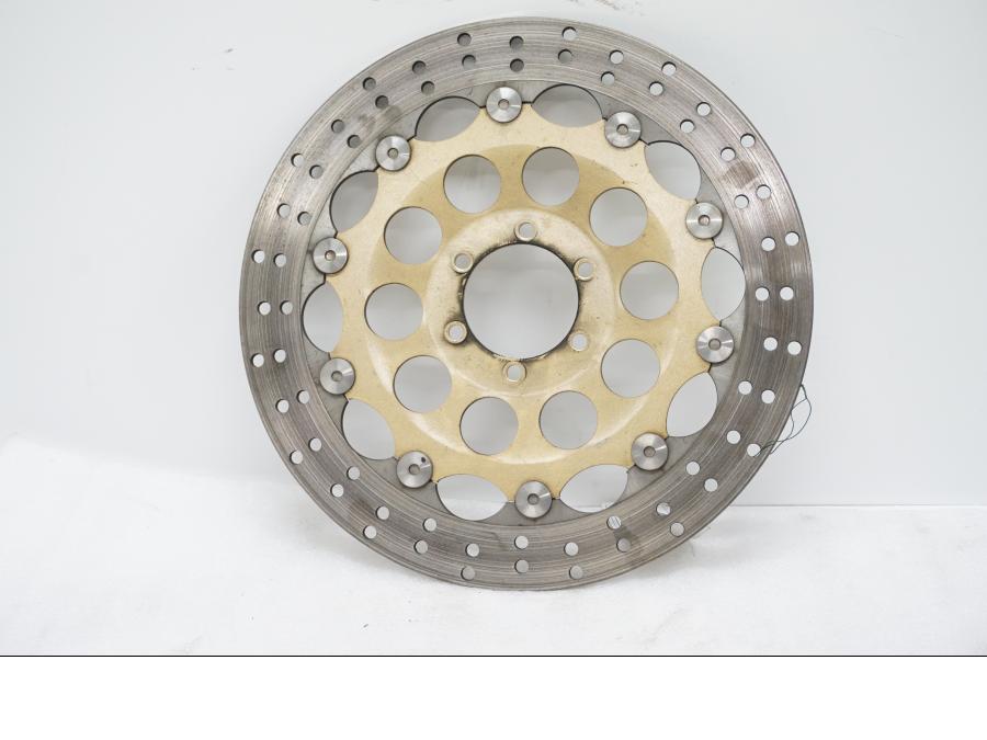 Framsidan på Bromsskiva från en Ducati Monster 900 -1998 motorcykel.