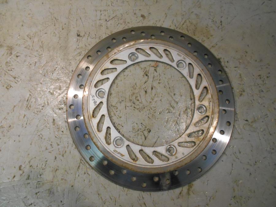 Framsidan på Bromsskiva från en Honda CBR 125 R -2007 motorcykel.