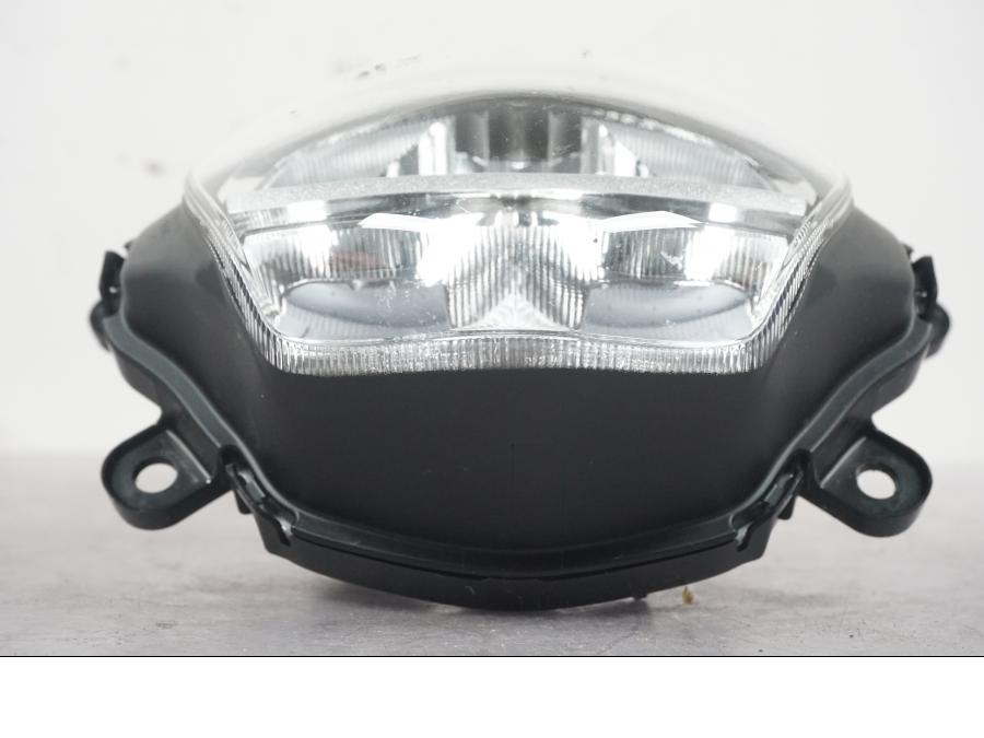 Vänster sida på Strålkastare från en Honda ANC 125 -2022 scooter.