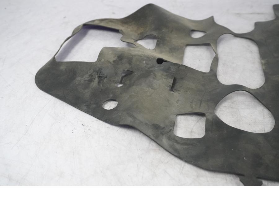 Vänster sida på Värmeskydd från en Kawasaki ZX-10R -2008 motorcykel.