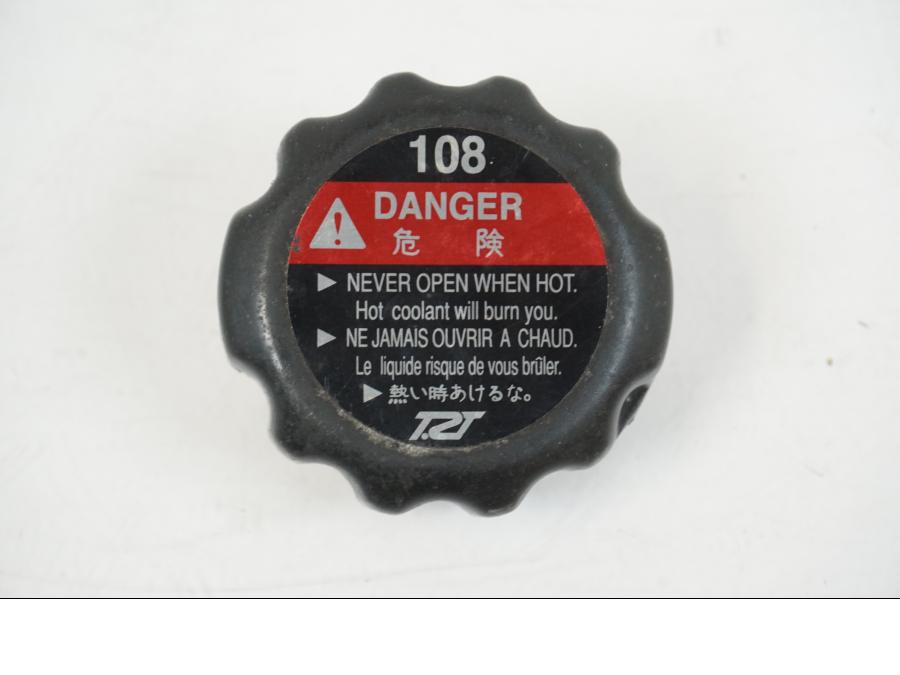 Framsidan på Vattenkyllock från en Honda CBR 125 R -2006 motorcykel.