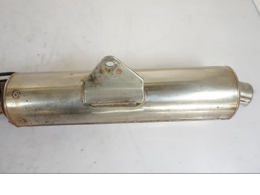 Vänster sida på Avgassystem från en Honda CBR 125 R -2006 motorcykel.