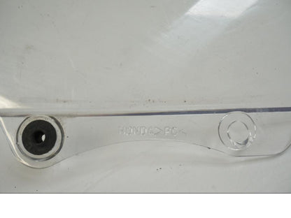 Vänster sida på Vindruta från en Honda CBR 125 R -2006 motorcykel.