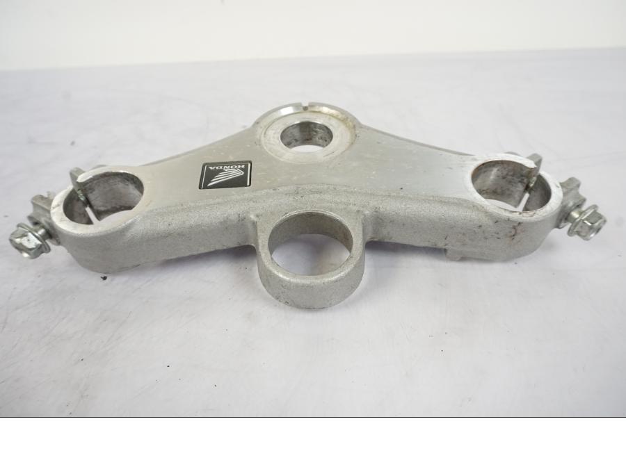 Vänster sida på Gaffelkrona från en Honda CBR 125 R -2006 motorcykel.