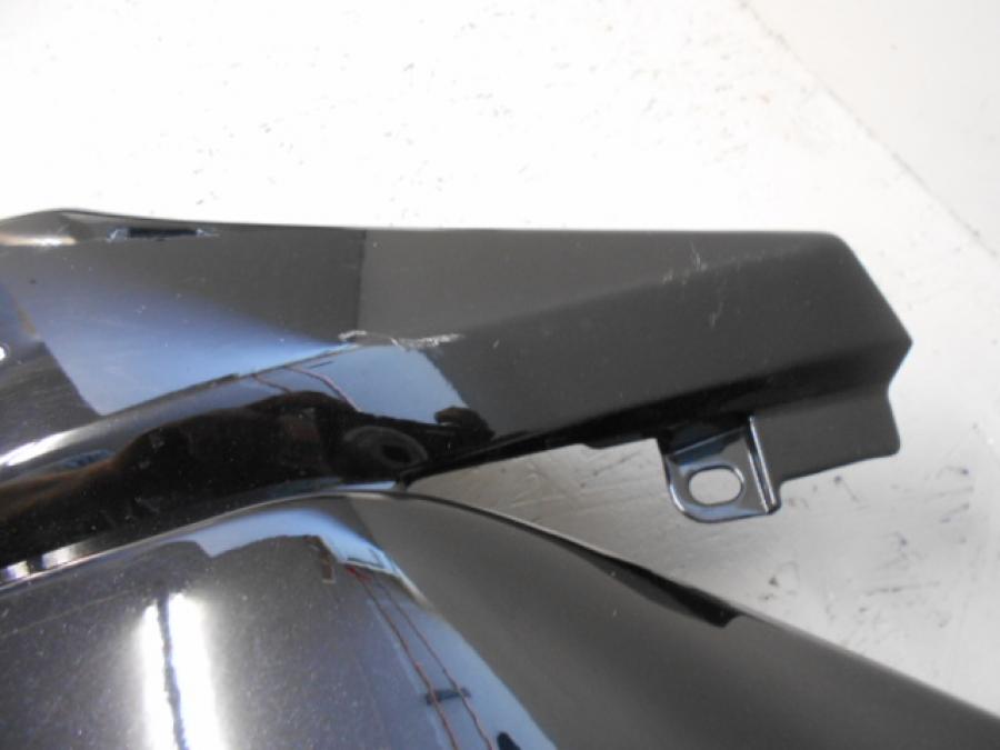 Vänster sida på Sidkåpa från en Kawasaki Ninja 250 -2009 motorcykel.