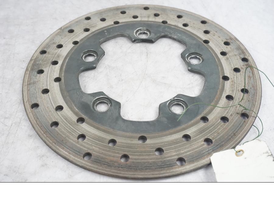 Vänster sida på Bromsskiva från en Suzuki SV 1000 -2004 motorcykel.