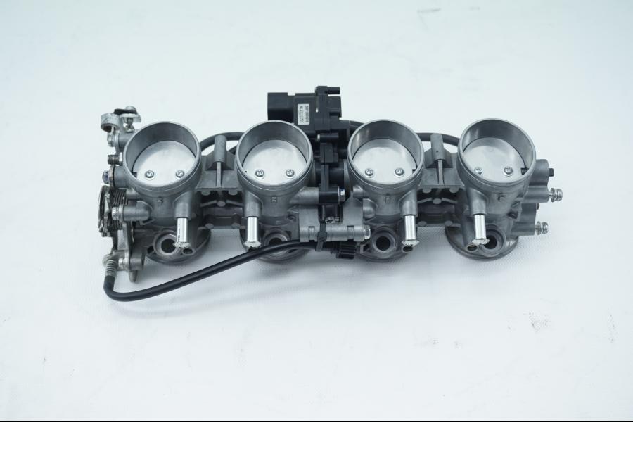 Framsidan på Spjällhus från en Kawasaki ZX-6R -2007 motorcykel.