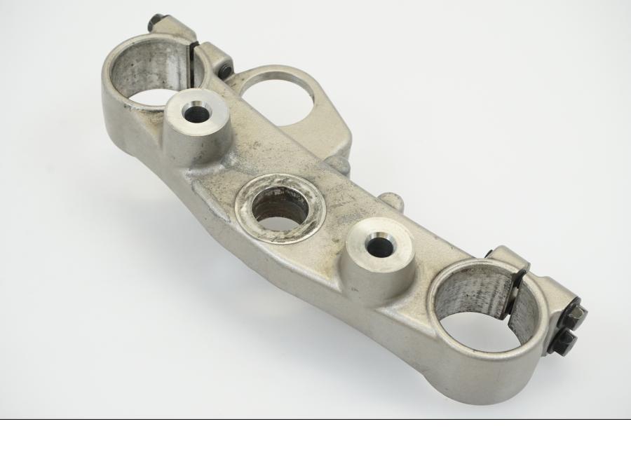 Vänster sida på Gaffelkrona från en Yamaha WR 125 -2010 motorcykel.