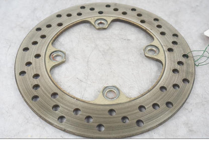 Framsidan på Bromsskiva från en Kawasaki ZX-6R -1999 motorcykel.