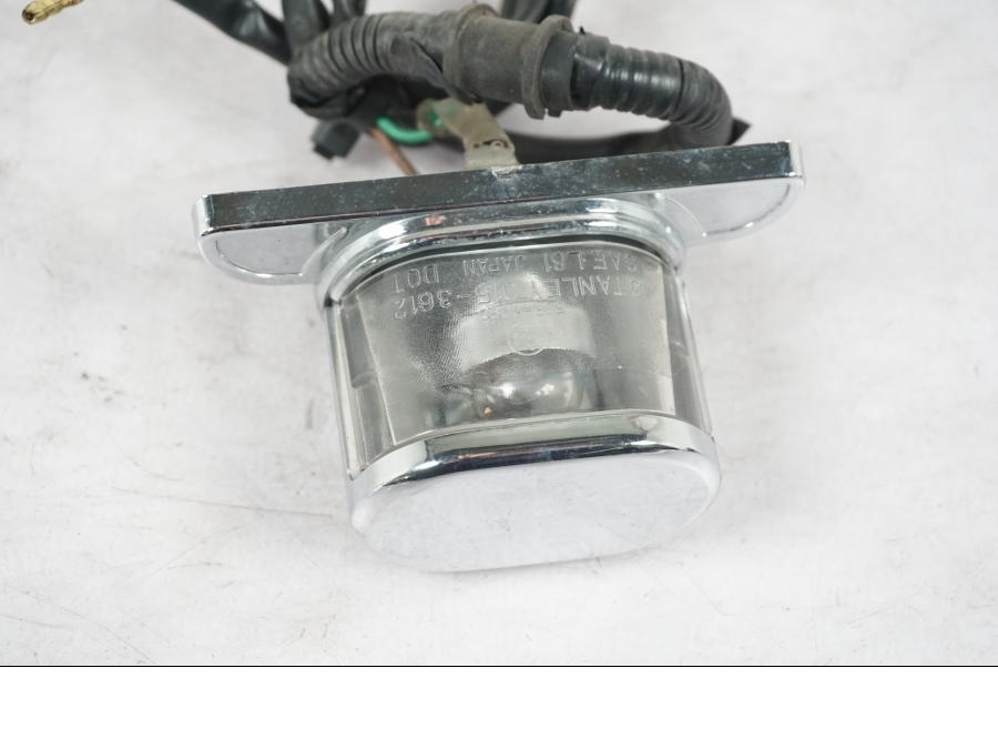 Höger sida på Skyltbelysning från en Honda VT 600 C -1998 motorcykel.