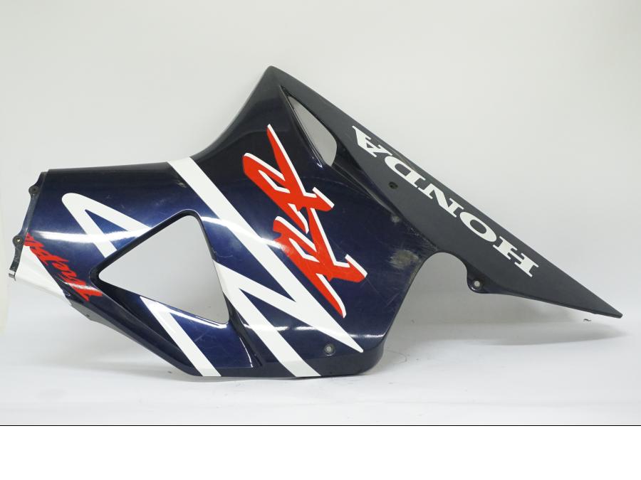 Vänster sida på Sidkåpa från en Honda CBR 900 RR -2002 motorcykel.