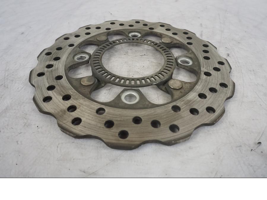 Vänster sida på Bromsskiva från en Kawasaki ER-6F -2010 motorcykel.