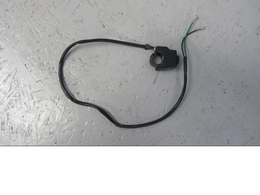 Framsidan på Tryckknappsreglage från en Suzuki LTA 750 XP E -2009 motorcykel.