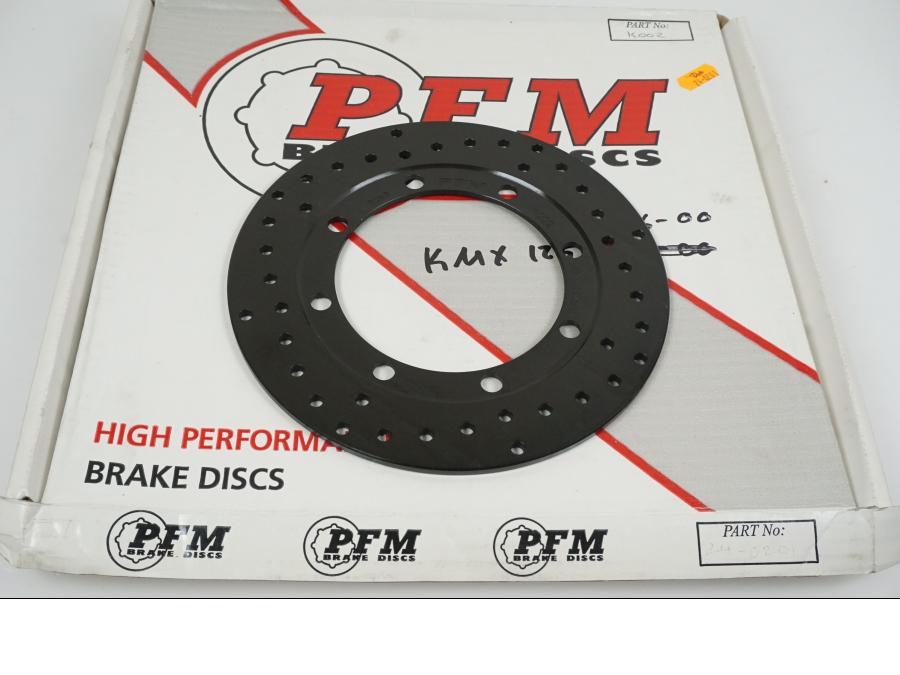 Framsidan på Bromsskiva från en Kawasaki KMX 125 -2000 motorcykel.