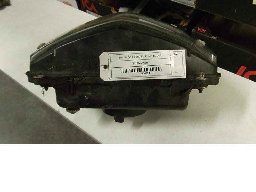 Vänster sida på Strålkastare från en Honda VTR 1000 F -1997 motorcykel.