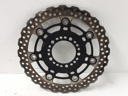 Framsidan på Bromsskiva från en Kawasaki ER-6N -2015 motorcykel.