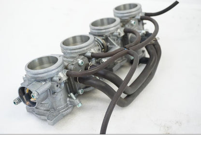 Vänster sida på Spjällhus från en Honda CBR 1000 RR -2010 motorcykel.