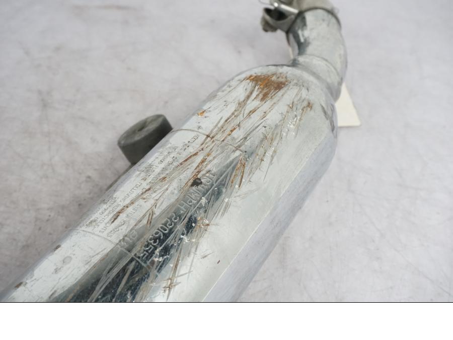 Vänster sida på Ljuddämpare från en Triumph Bonneville -2012 motorcykel.