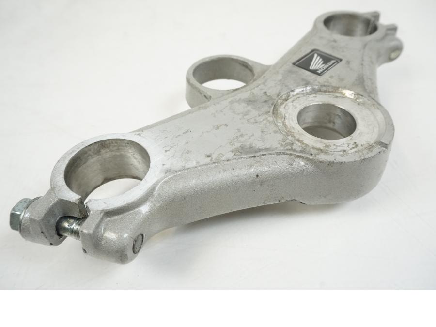 Vänster sida på Gaffelkrona från en Honda CBR 125 R -2006 motorcykel.