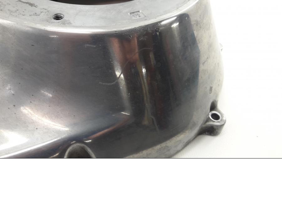 Baksidan på Transmissionskåpa från en H-D Harley diverse -2012 motorcykel.