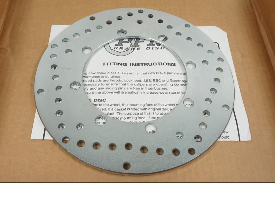 Baksidan på Bromsskiva från en Kawasaki KMX 125 -2000 motorcykel.