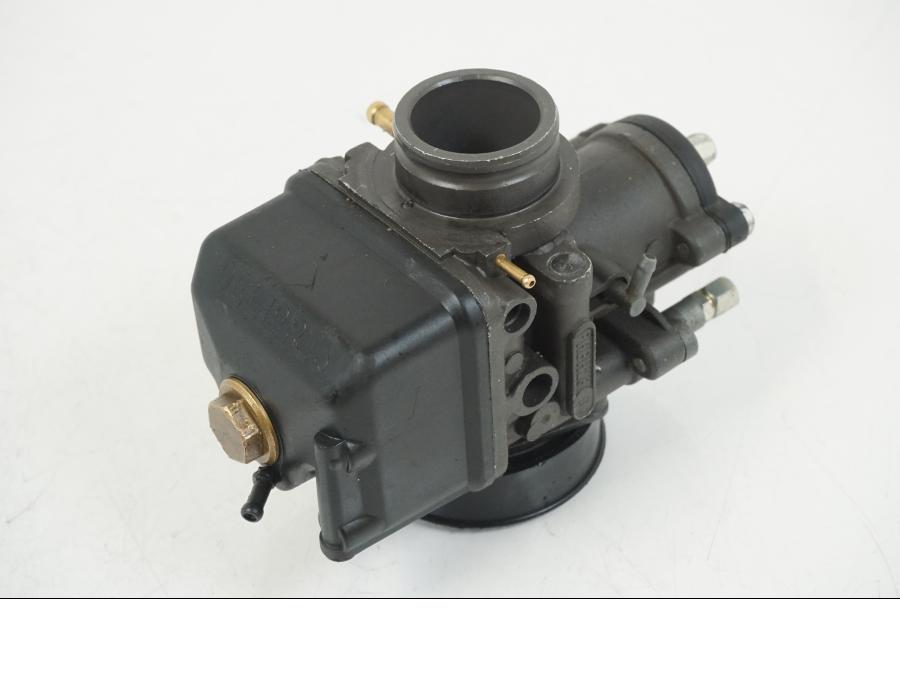 Framsidan på Förgasare från en Aprilia RS 125 -2008 motorcykel.