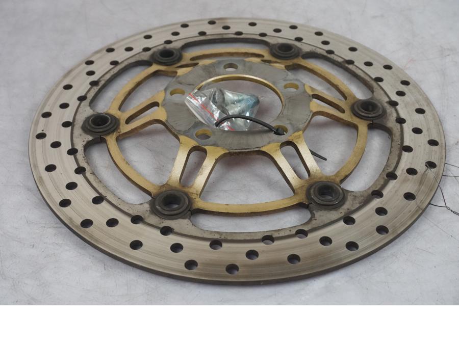 Vänster sida på Bromsskiva från en Suzuki SV 650 -1999 motorcykel.