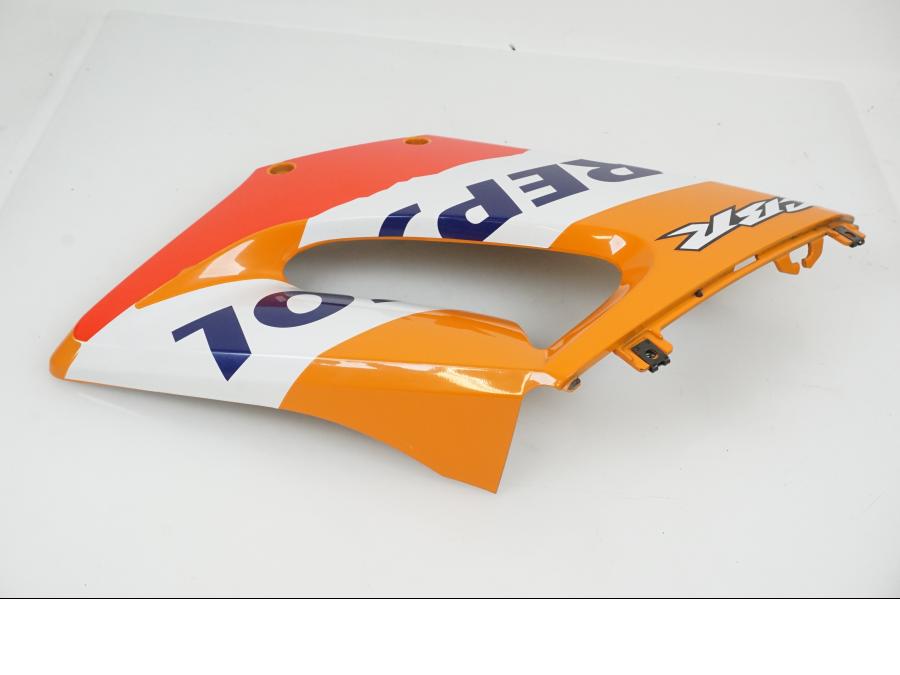 Vänster sida på Sidkåpa från en Honda CBR 125 R -2006 motorcykel.