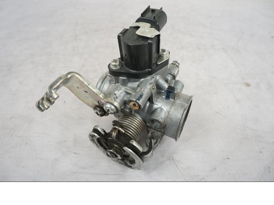 Baksidan på Spjällhus från en Yamaha MT 125 -2017 motorcykel.