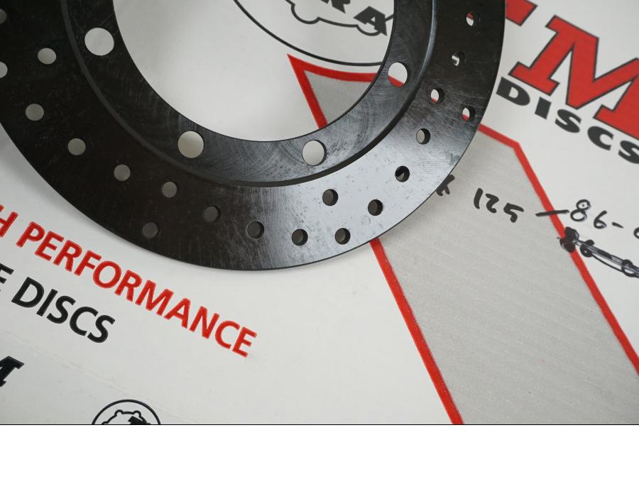 Höger sida på Bromsskiva från en Kawasaki KMX 125 -2000 motorcykel.