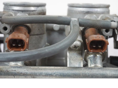 Vänster sida på Spjällhus från en Suzuki GSX-R 750 -2007 motorcykel.