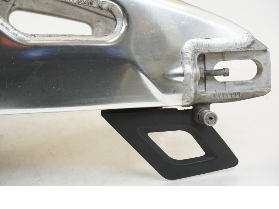 Vänster sida på Sving från en Aprilia Tuono V4R -2011 motorcykel.