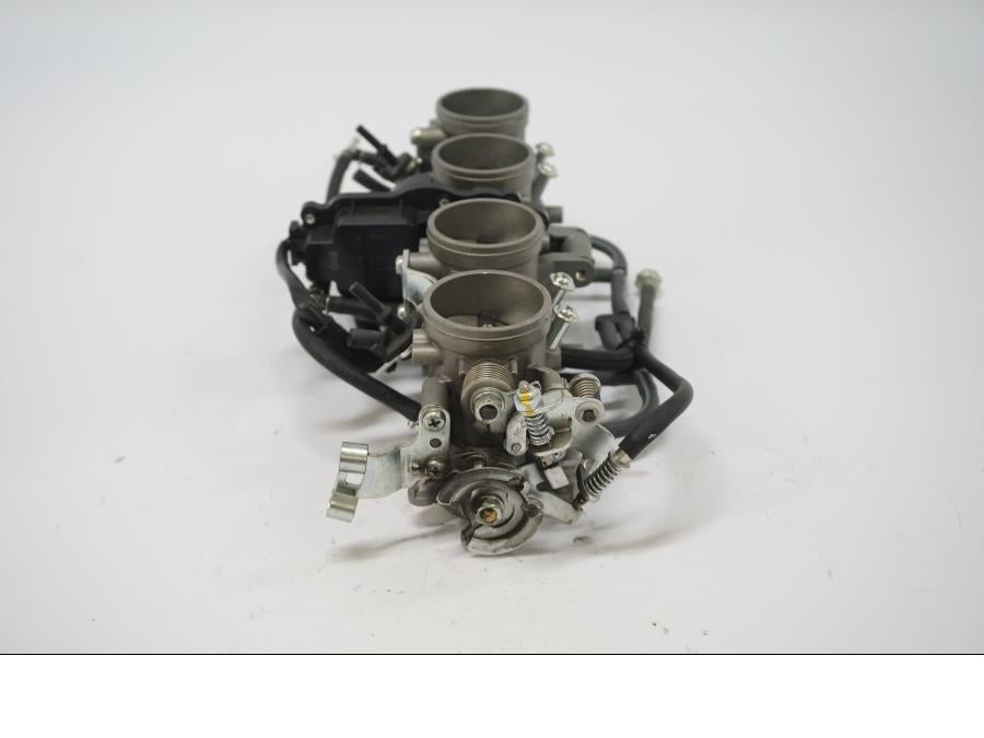 Vänster sida på Spjällhus från en Kawasaki Z 900 -2019 motorcykel.