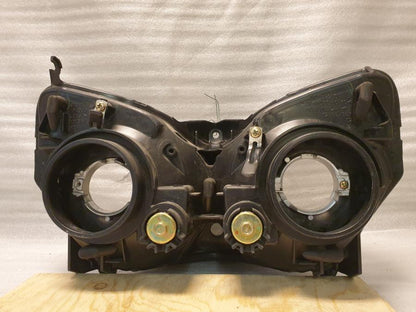 Vänster sida på Strålkastare från en Honda CBR 125 R -2004 motorcykel.