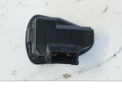 Baksidan på Tryckknappsreglage från en Honda SH 300 A -2011 scooter.