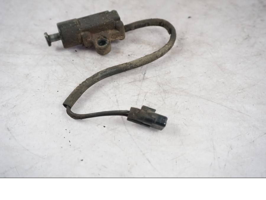 Vänster sida på Sidostödsbrytare från en Triumph Tiger Explorer -2016 motorcykel.