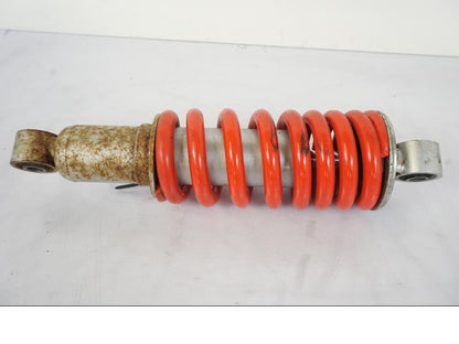 Vänster sida på Stötdämpare från en Honda CBR 125 R -2006 motorcykel.