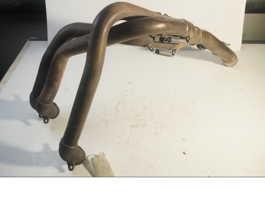 Vänster sida på Grenrör från en Triumph Daytona T 595 -1998 motorcykel.