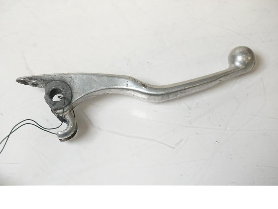 Framsidan på <p>Bromsgrepp från Husqvarna TE 310 2009.</p>

<p>Mindre skrapmärken på knoppen samt ytliga repor se bilder.</p> motorcykel.