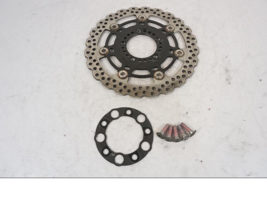 Framsidan på Bromsskiva från en Kawasaki ER-6F -2010 motorcykel.