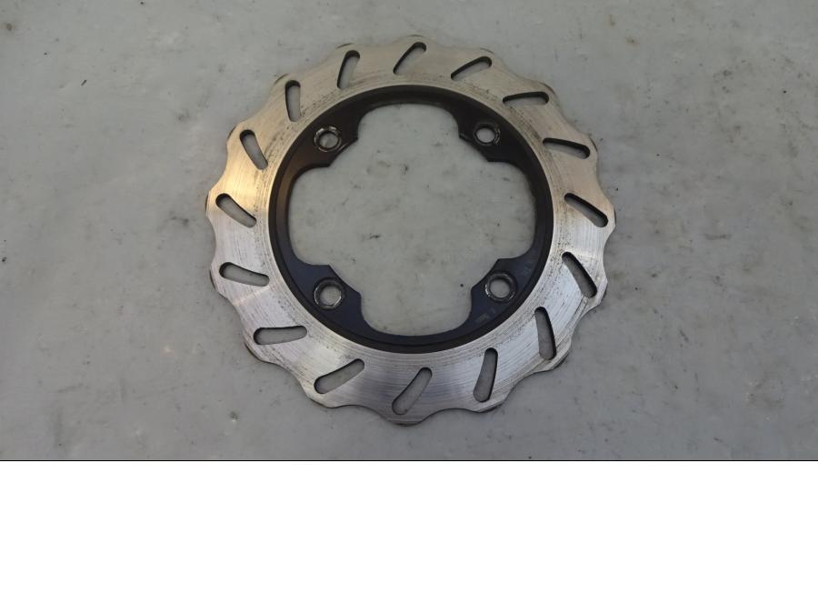 Framsidan på Bromsskiva från en Honda VTR 1000 F -1997 motorcykel.