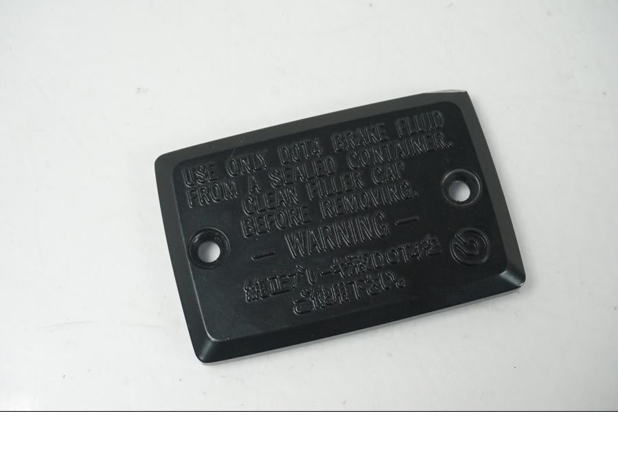 Framsidan på Bromshuvudcylinderskydd från en Yamaha Tracer 700 GT -2024 motorcykel.