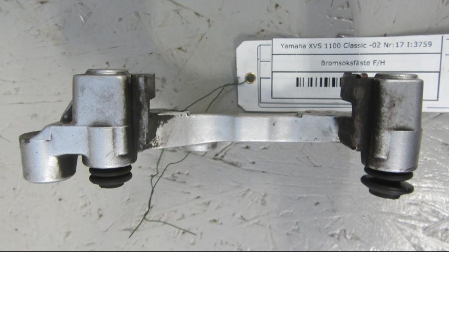 Vänster sida på Bromsoksfäste från en Yamaha XVS 1100 -2002 motorcykel.