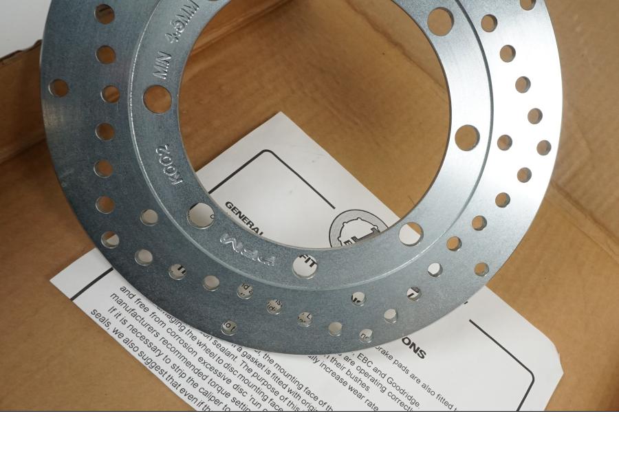 Vänster sida på Bromsskiva från en Kawasaki KMX 125 -2000 motorcykel.