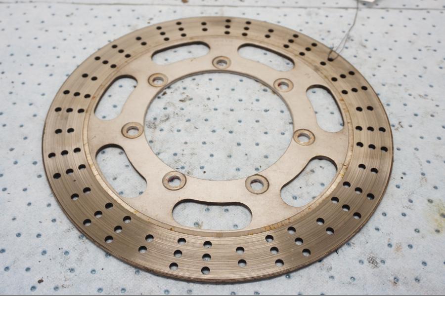 Framsidan på Bromsskiva från en Kawasaki EN 500 -1999 motorcykel.