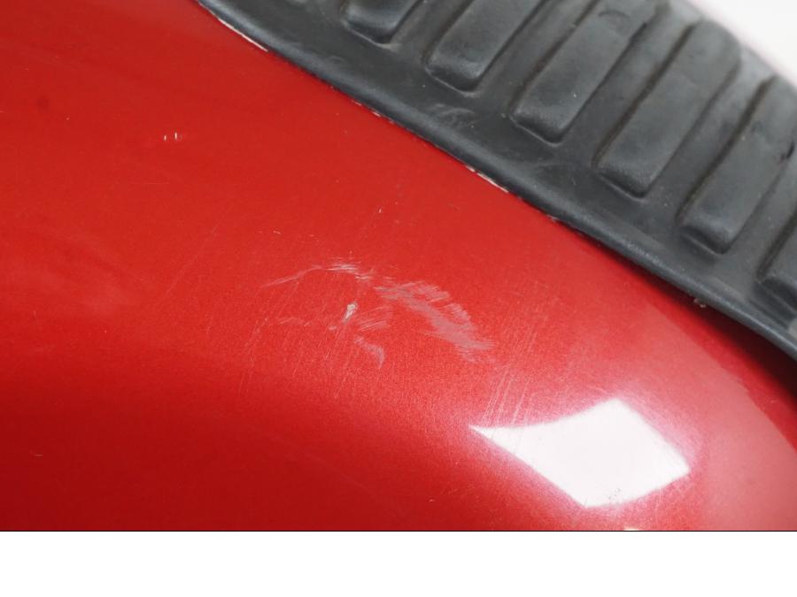 Vänster sida på Bensintank från en Honda NT 650 V -2002 motorcykel.