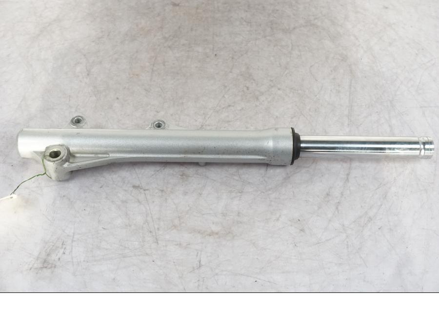 Vänster sida på Gaffelben från en Honda ANF 125 -2009 motorcykel.