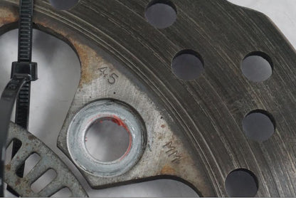 Vänster sida på Bromsskiva från en Kawasaki ER-6N ABS -2010 motorcykel.